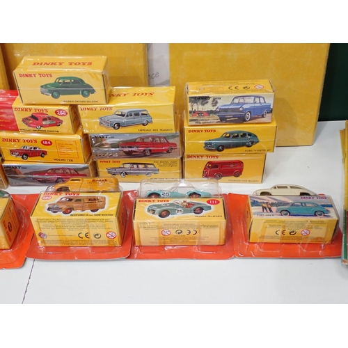 34 - Twenty boxed Atlas Models Dinky Toys, three Folders, two Badges and a collection of Classic Dinky To... 