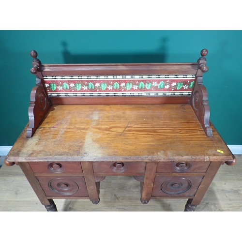 341 - An Arts and Crafts pitch pine Wash Stand with raised tile back fitted three frieze drawers above two... 