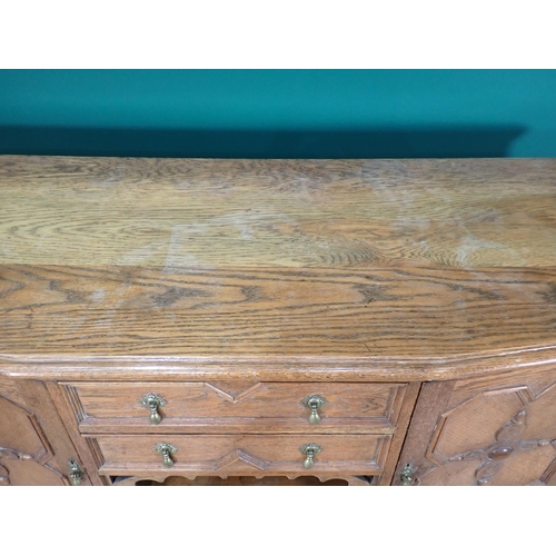 342 - A moulded oak Sideboard fitted pair of cupboard doors flanking two drawers and open shelf mounted on... 