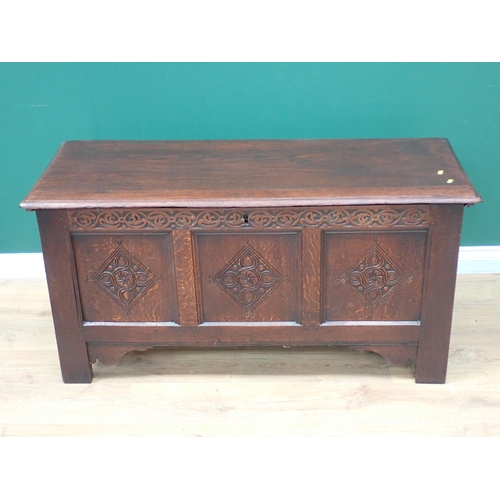 357 - A 17th Century and later oak Coffer with moulded plank lid above carved three panel front 4ft 4in W ... 