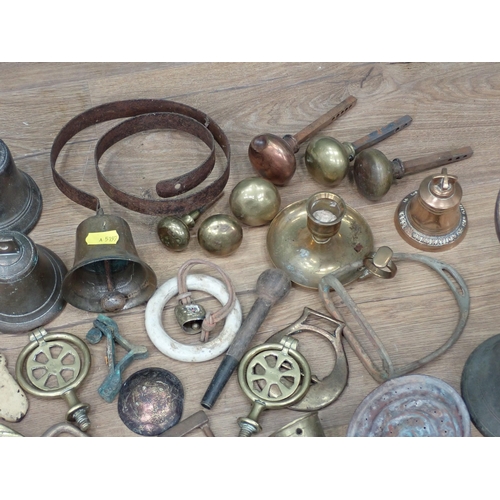 361 - A box of metal and brass including Bells, Servants Bells, Casters, etc.