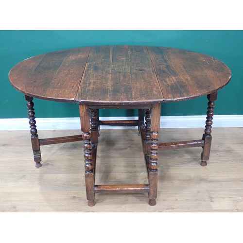 363 - A late 17th Century and later oak Gateleg Table on ball and fillet turned legs united by stretchers ... 