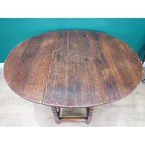 363 - A late 17th Century and later oak Gateleg Table on ball and fillet turned legs united by stretchers ... 