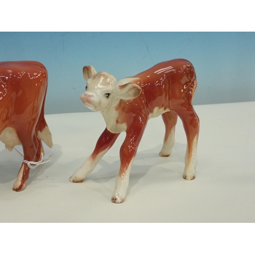 385 - A Beswick figure of Guernsey Cow with horns, a figure of Calf and a figure of Pig