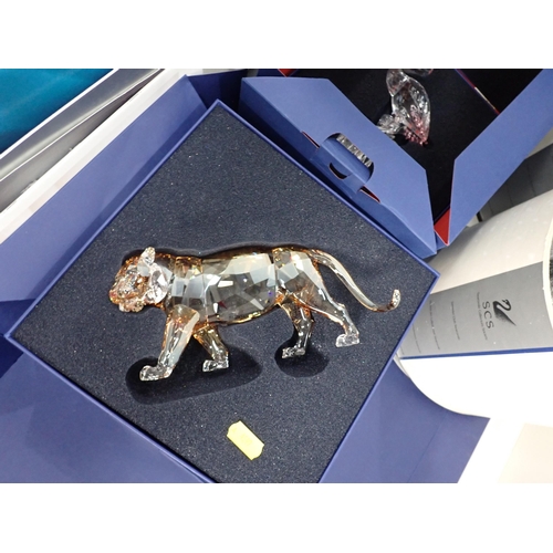 518 - Six boxed Swarovski crystal Figurines including Horse, Tiger, Dolphins, Flamingo, Peacock and Lovebi... 