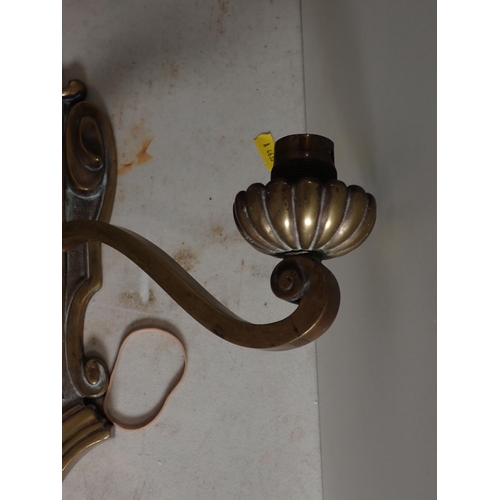 537 - A pair of antique brass two branch Wall Lights