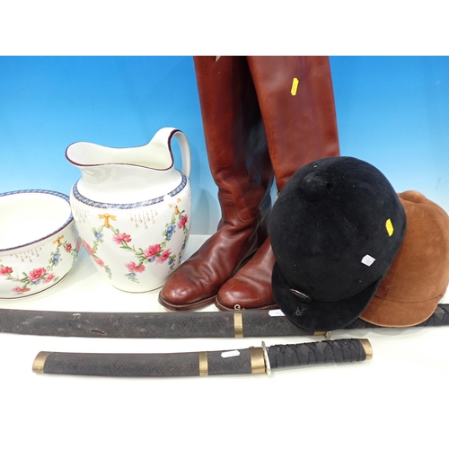 562 - A pair of brown leather Riding Boots, two Riding Hats, a Toilet Jug and Chamber Pot and reproduction... 