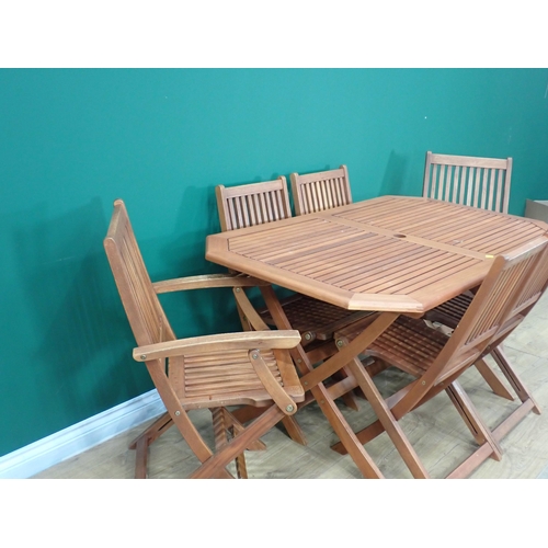 563 - A teak Garden Table and six Chairs