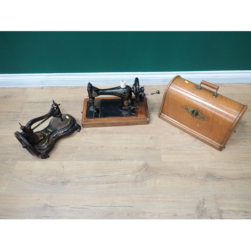 583 - A Singer Sewing Machine in case and another Victorian Sewing Machine and a Nest of Tables