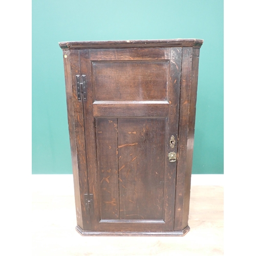 590 - An antique oak hanging Corner Cupboard with later shelves and back 4ft H x 2ft 7in W