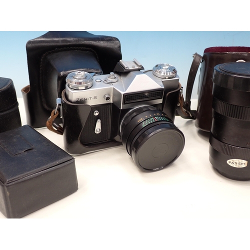 591 - A box of Cameras and Equipment including Zenit-E Camera and various Lenses