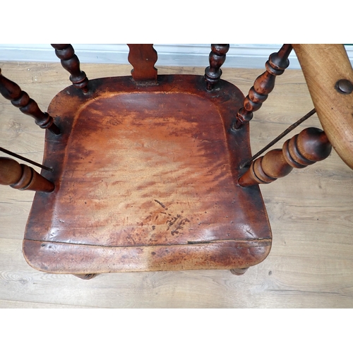 599 - A 19th Century ash Windsor style Armchair with pierced splat back mounted on turned supports with do... 