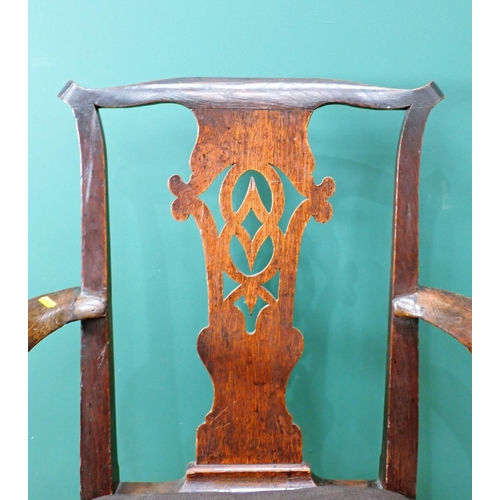 603 - An 18th Century oak Elbow Chair with pierced splat back and raised on cabriole front supports