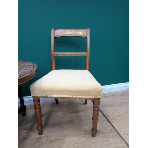 605 - A pair of 19th Century mahogany bar-back Dining Chairs and a carved oval Occasional Table