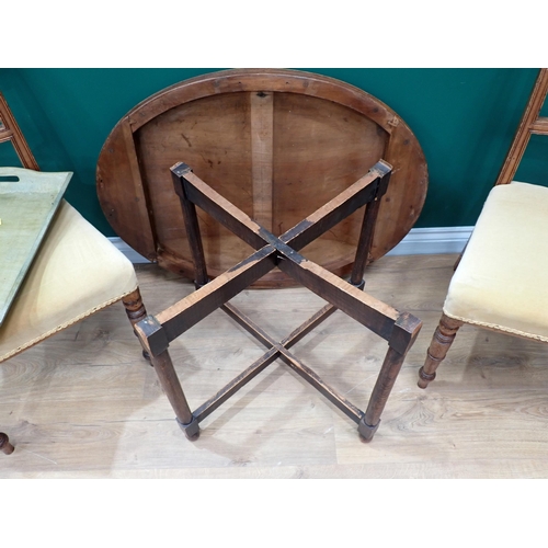 605 - A pair of 19th Century mahogany bar-back Dining Chairs and a carved oval Occasional Table