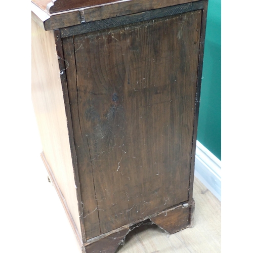 610 - A pair of walnut Bedside Chests each fitted three drawers and an ash and elm Oxford Chair