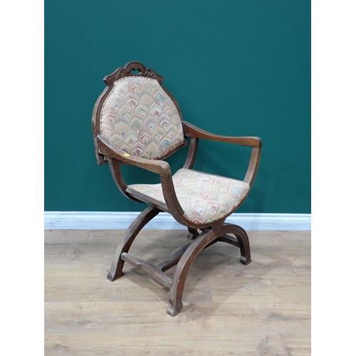 616 - A walnut framed X-frame Elbow Chair A/F