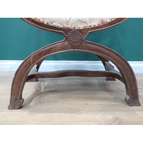 616 - A walnut framed X-frame Elbow Chair A/F