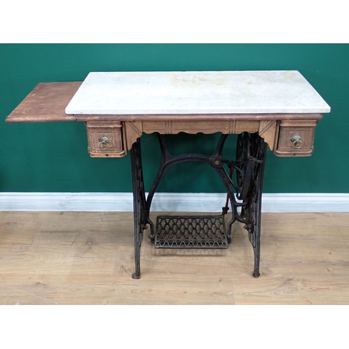 658 - A marble topped Sewing Machine Table