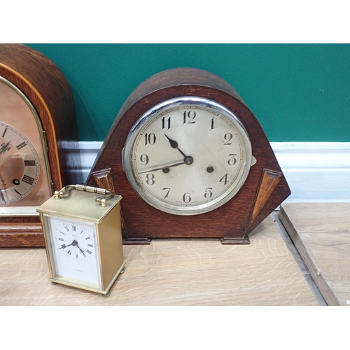 667 - A walnut cased Mantel Clock, two oak cased Mantel Clock and three other Clocks