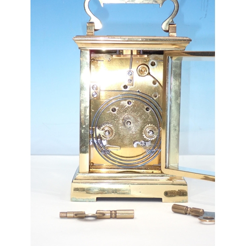 693 - A brass cased Carriage Clock 6in H