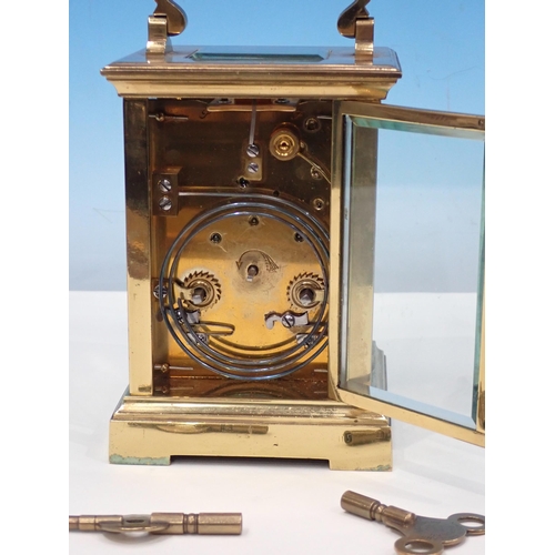 693 - A brass cased Carriage Clock 6in H