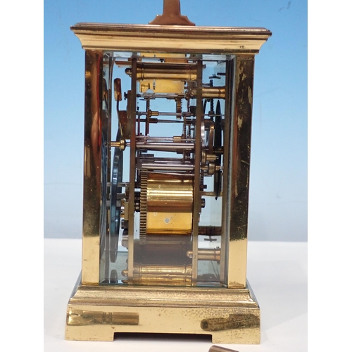 693 - A brass cased Carriage Clock 6in H