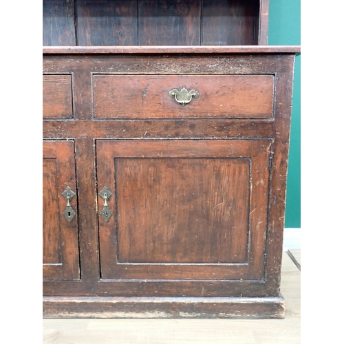 696 - A 19th Century stained pine Dresser and Rack fitted two frieze drawers above pair of cupboard doors ... 