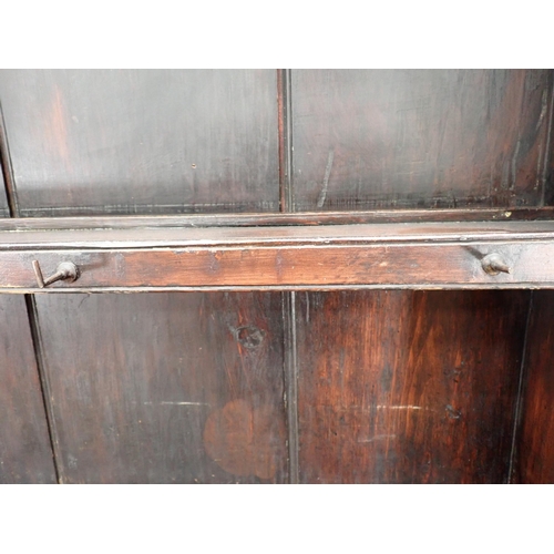 696 - A 19th Century stained pine Dresser and Rack fitted two frieze drawers above pair of cupboard doors ... 