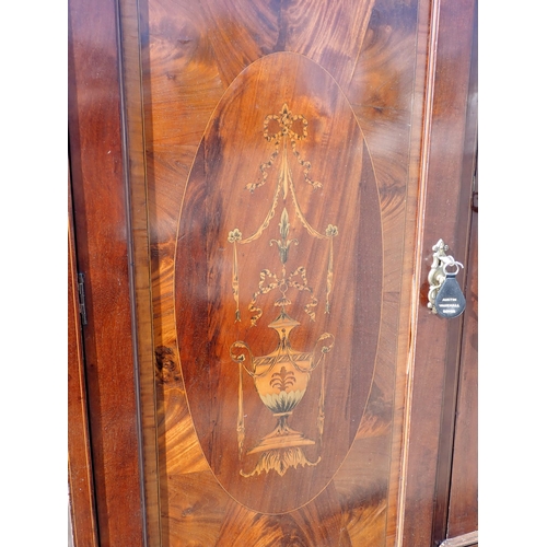 702 - A 19th Century flame mahogany and urn inlaid Triple Wardrobe 7ft 10in H x 6ft 4in W and Dressing Tab... 