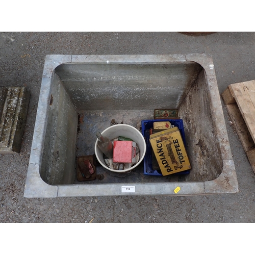 712 - A galvanised Water Tank and a quantity of Tins and glass Bottles