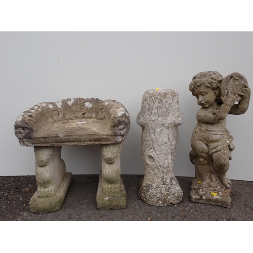 716 - A composite Garden Figure of a cherub playing a tambourine, 1ft 11in H, a composite Garden Seat and ... 