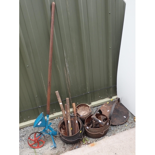 729 - A hand driven Seed Drill, Cauldrons, Shoe Lasts, Griddle and Tools