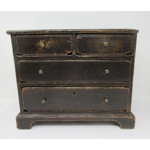 600 - A 19th Century Apprentice Piece stained pine Chest of two short and two long drawers on bracket feet... 