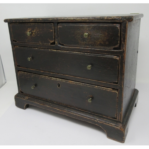 600 - A 19th Century Apprentice Piece stained pine Chest of two short and two long drawers on bracket feet... 