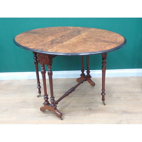 601 - A Victorian burr walnut Sutherland Table on turned supports 2ft 11in W x 2ft 4in H