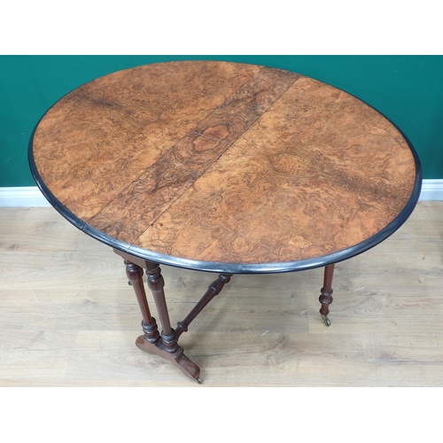 601 - A Victorian burr walnut Sutherland Table on turned supports 2ft 11in W x 2ft 4in H