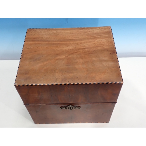 603 - A Georgian mahogany Cellarette with chequer stringing, the hinged lid enclosing five divisions and f... 