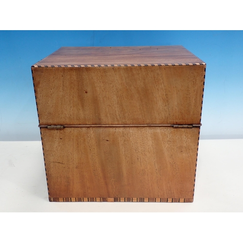 603 - A Georgian mahogany Cellarette with chequer stringing, the hinged lid enclosing five divisions and f... 