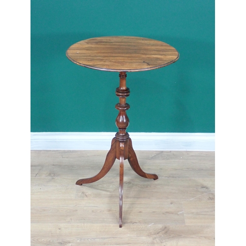 604 - A 19th Century rosewood Pillar Table with circular moulded top above a finely turned baluster column... 