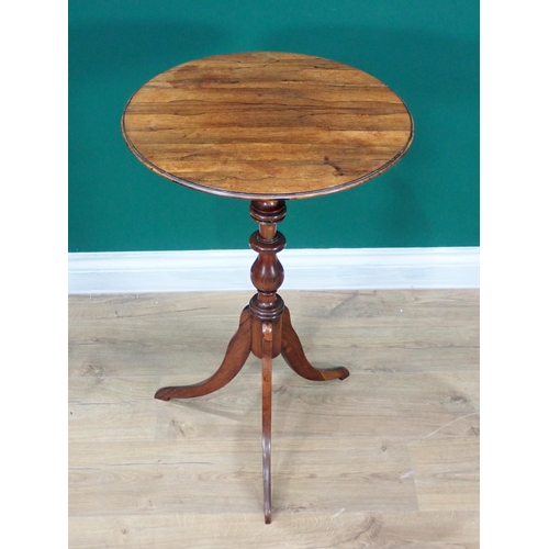 604 - A 19th Century rosewood Pillar Table with circular moulded top above a finely turned baluster column... 