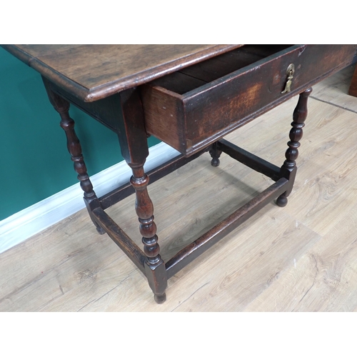 746 - A late 17th Century oak Side Table fitted frieze drawer and raised on baluster turned supports with ... 