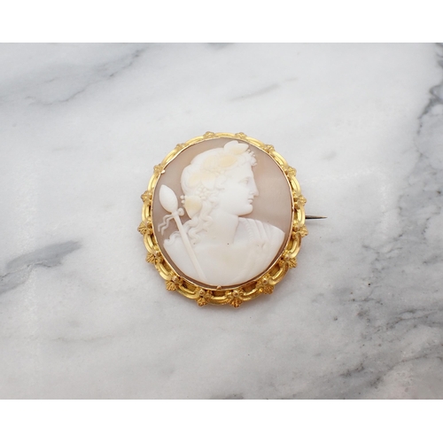 75 - A carved shell Cameo Brooch of Bacchus in intricate unmarked frame, approx 35mm x 42mm