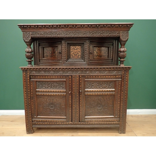 753 - A Charles I and later oak Court Cupboard, the upper section fitted pair of cupboard doors, the inlai... 