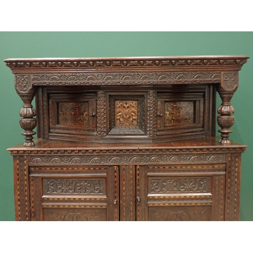 753 - A Charles I and later oak Court Cupboard, the upper section fitted pair of cupboard doors, the inlai... 