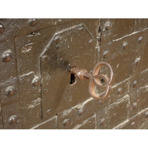 755 - A 17th Century iron bound oak Strong Box with single key lock, two handles and strap hinged lid encl... 