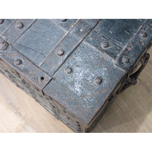 755 - A 17th Century iron bound oak Strong Box with single key lock, two handles and strap hinged lid encl... 