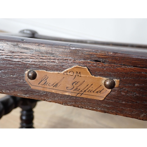 762 - Two 17th Century and later oak Derbyshire Chairs both with mask and scroll carved double back rails