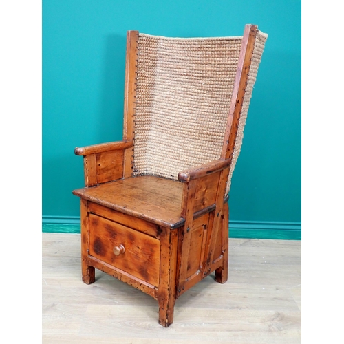 763 - A late 19th or early 20th Century pine Orkney Chair with traditional woven back, scroll ends to arm ... 