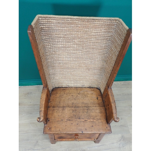 763 - A late 19th or early 20th Century pine Orkney Chair with traditional woven back, scroll ends to arm ... 